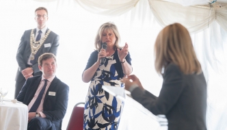 Anne Main joins local business owners and employees at the St Albans Chamber of Commerce Business Breakfast