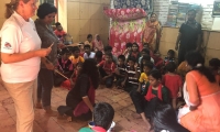 Anne Main MP with children from LEEDO 